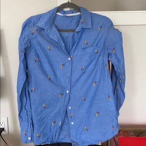 Long sleeve, button down, tropical print shirt.